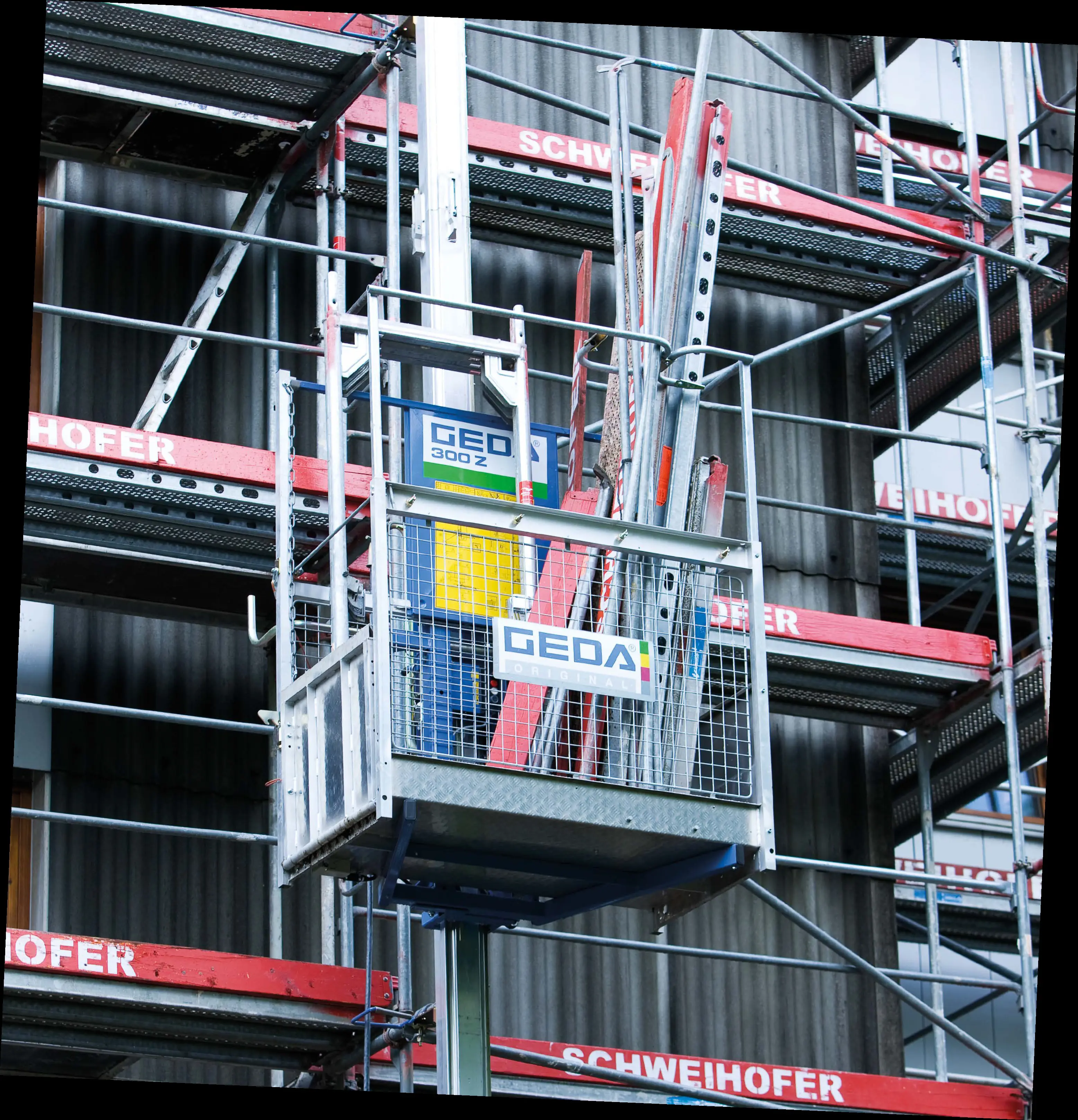 Mast climbing transport platforms for persons and materials